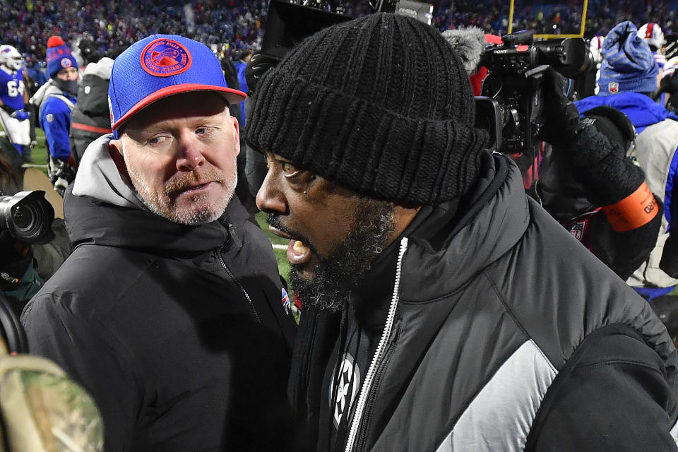 Buffalo Bills head coach Sean McDermott, left, and Pittsburgh Steelers head coach Mike Tomlin meet at mid field after an NFL wild-card playoff football game, Monday, Jan. 15, 2024, in Buffalo, N.Y. (AP Photo/Adrian Kraus)