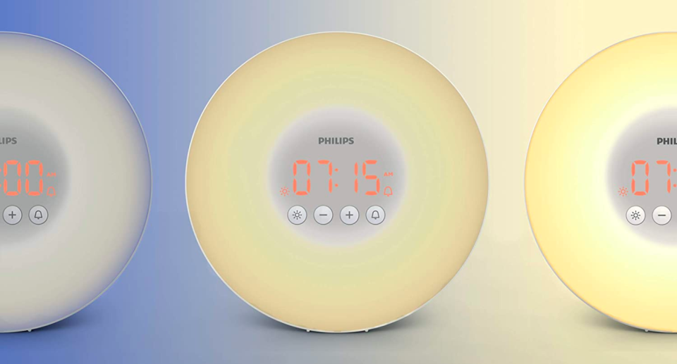 Philips SmartSleep Wake-Up Light Therapy Alarm Clock gradually brightening from dark to bright light