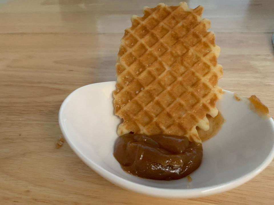 a piece of stroopwafel with cinnamon bun spread