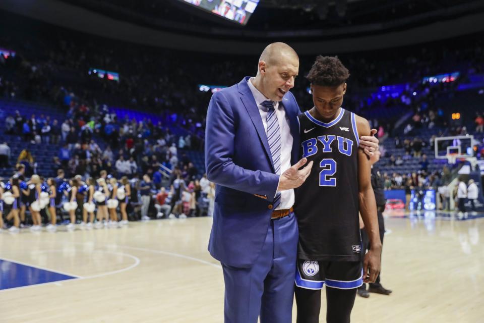 BYU coach Mark Pope talks to Jaxson Robinson after beating the Weber State Wildcats in Provo on Thursday, Dec. 22, 2022.