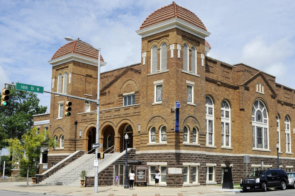 Visitors look at 16th Street Baptist Church in Birmingham, Ala., on Friday, July 29, 2016. The church was the scene of a Ku Klux Klan bombing that killed four black girls in 1963, and Alabama's parole board is scheduled next week to consider the early release of Thomas Edwin Blanton Jr., the last man serving time for the slayings. Blanton, the last of three one-time Ku Klux Klansmen convicted of a 1963 Alabama church bombing that killed four black girls and was the deadliest single attack of the civil rights movement, has died in prison, the governor's office said Friday. He was 81. (AP Photo/Jay Reeves)