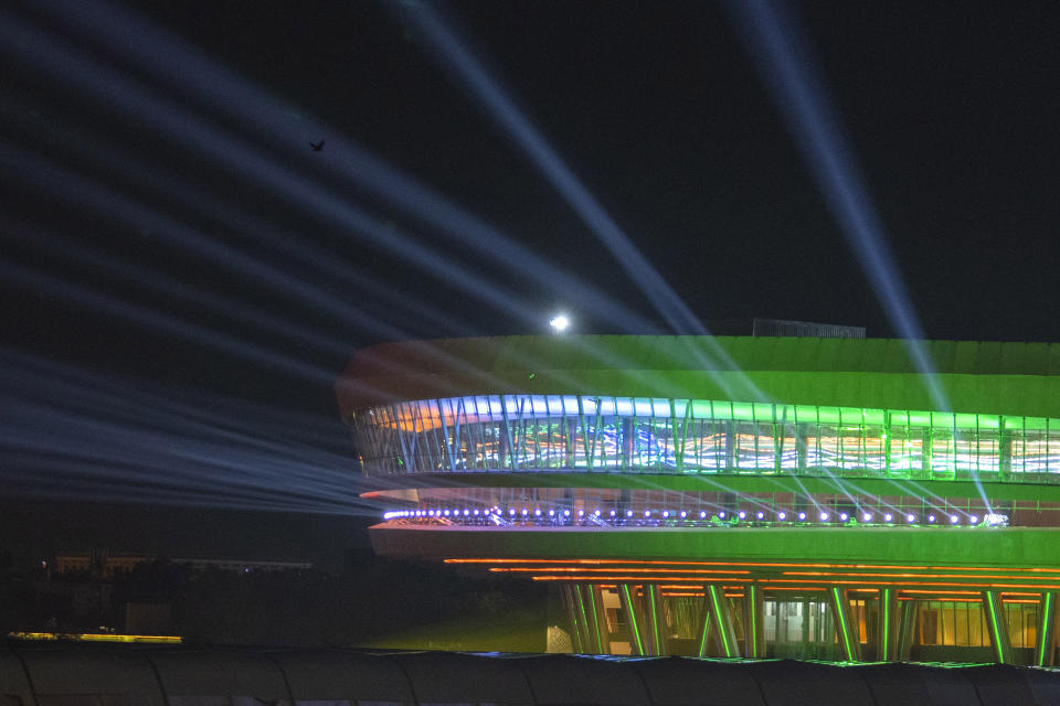 Bharat Mandapam Convention center the dinner venue for G20 leaders, is seen illuminated during the summit in New Delhi,India, Saturday, Sept. 9, 2023. When the leaders of the Group of 20 arrived in host country India, they were feted by a classic Indian formula of Bollywood song and dance on the tarmac. Now as they tuck in to dinner, they are in for yet another cultural treat: dressed-up versions of a humble, earthy grain that's a staple for millions of Indians. (AP Photo/Dar Yasin)