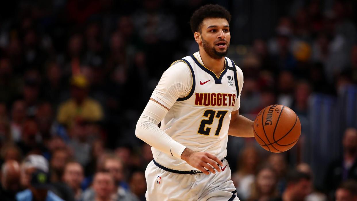 DENVER, CO - MARCH 09: Jamal Murray #27 of the Denver Nuggets dribbles up court against the Milwaukee Bucks at Pepsi Center on March 9, 2020 in Denver, Colorado.