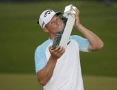 Britain Golf - BMW PGA Championship - Wentworth Club, Virginia Water, Surrey, England - 28/5/17 Sweden's Alex Noren celebrates winning the BMW PGA Championship by kissing the trophy Action Images via Reuters / Paul Childs Livepic