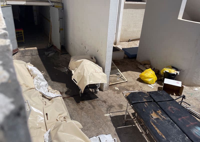 Dead bodies, lying in bags, are pictured at the entrance of Habib Bourguiba hospital morgue in Sfax