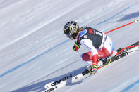 Switzerland's Lara Gut Behrami speeds down the course during an alpine ski, women's World Cup super-G, in Lenzerheide, Switzerland, Saturday, March 5, 2022. (AP Photo/Alessandro Trovati)