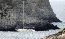 A sailboat is seen abandoned on the southern island of Kythera, Greece, on Wednesday, Aug. 17, 2022. The sailboat carried 97 migrants ran aground in Kythera in the early hours of the morning as a second boat arrive with dozens people on the island on Wednesday noon. (Giorgos Samios/kythera.news via AP)