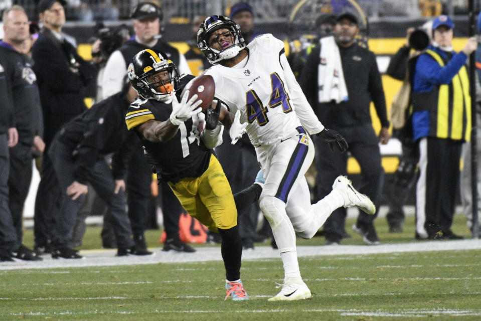 Pittsburgh Steelers wide receiver Ray-Ray McCloud (14) tries to make a catch as Baltimore Ravens cornerback Marlon Humphrey (44) defends during the second half of an NFL football game, Sunday, Dec. 5, 2021, in Pittsburgh. The play was called a reception, but overturned as an incomplete pass on a challenge review. (AP Photo/Don Wright)