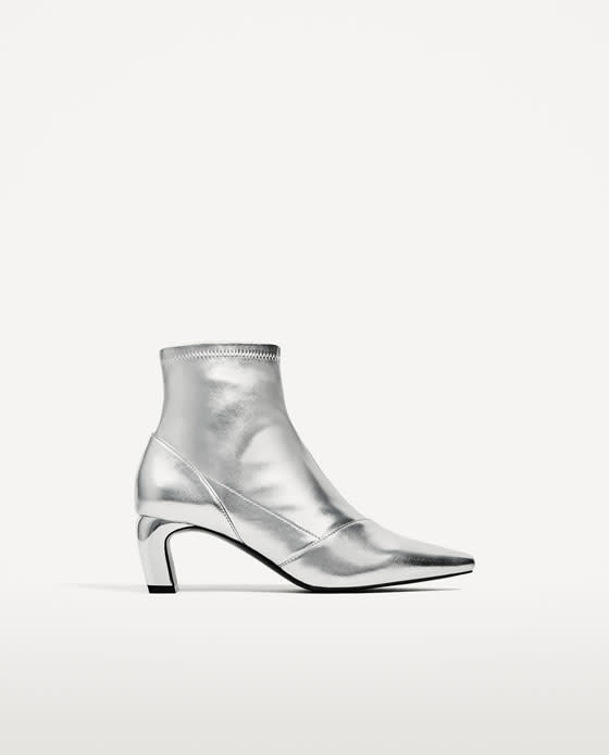 <p><a rel="nofollow noopener" href="https://www.zara.com/uk/en/woman/mid-season-%7C-50-off/silver-toned-elastic-high-heel-ankle-boots-c818525p4242506.html" target="_blank" data-ylk="slk:Zara, £24.99;elm:context_link;itc:0;sec:content-canvas" class="link "><i>Zara, £24.99</i></a> </p>