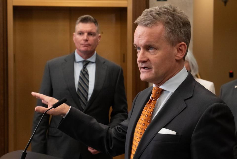 World Energy GH2 CEO Sean Leet, left, looks on as Labour and Seniors Minister Seamus O’Regan speaks during an announcement in the Foyer of the House of Commons, Wednesday, February 28, 2024 in Ottawa.  THE CANADIAN PRESS/Adrian Wyld