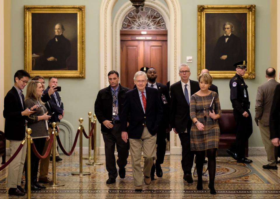Senate Majority Leader Mitch McConnell walks to his office before the Senate impeachment trial against President Donald Trump on Jan.  25.