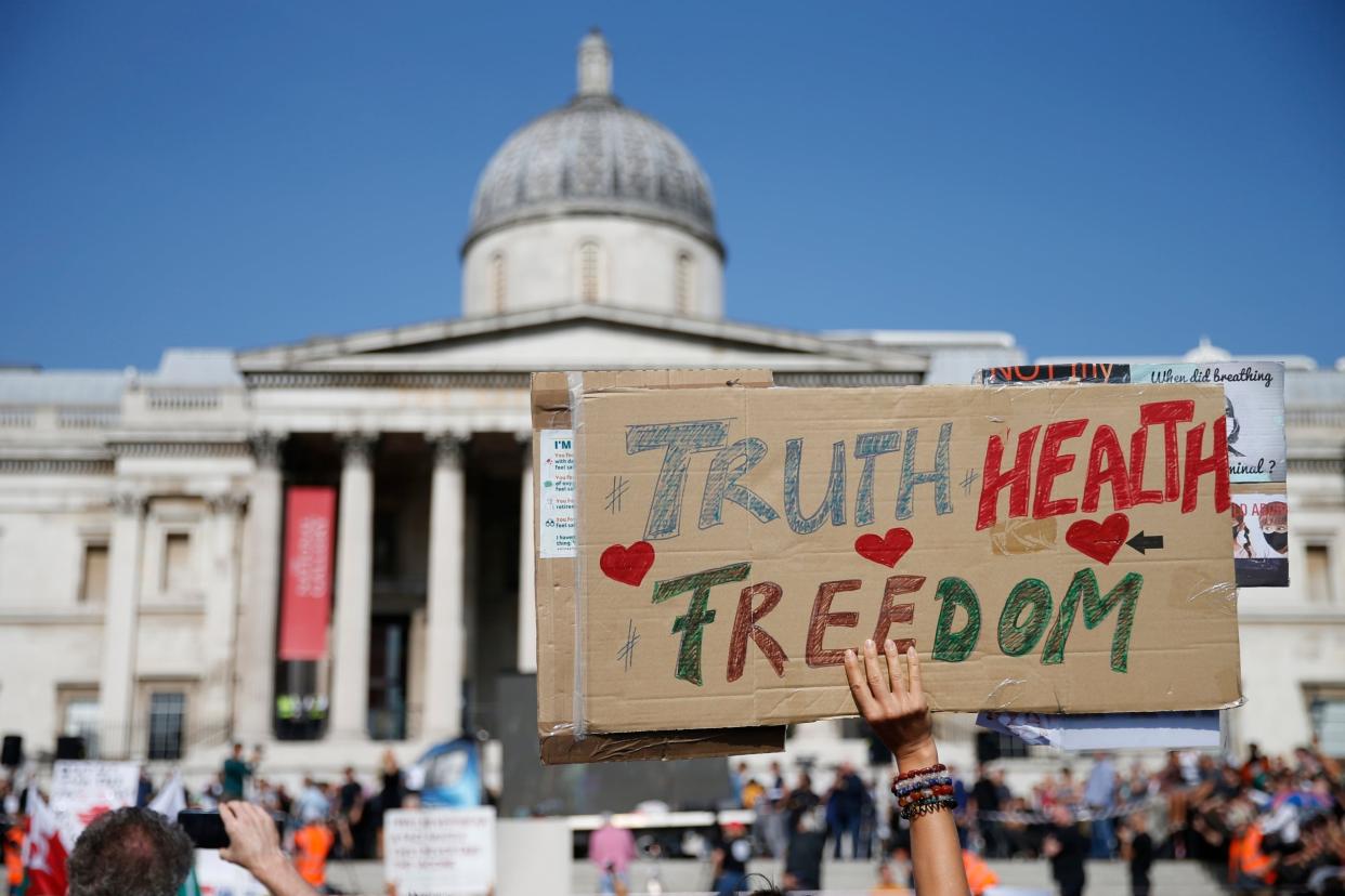 Warning signs: the anti-vax rally at Trafalgar Square on Saturday. About 2,000 people attended, and 30 or so were arrested (Getty Images)