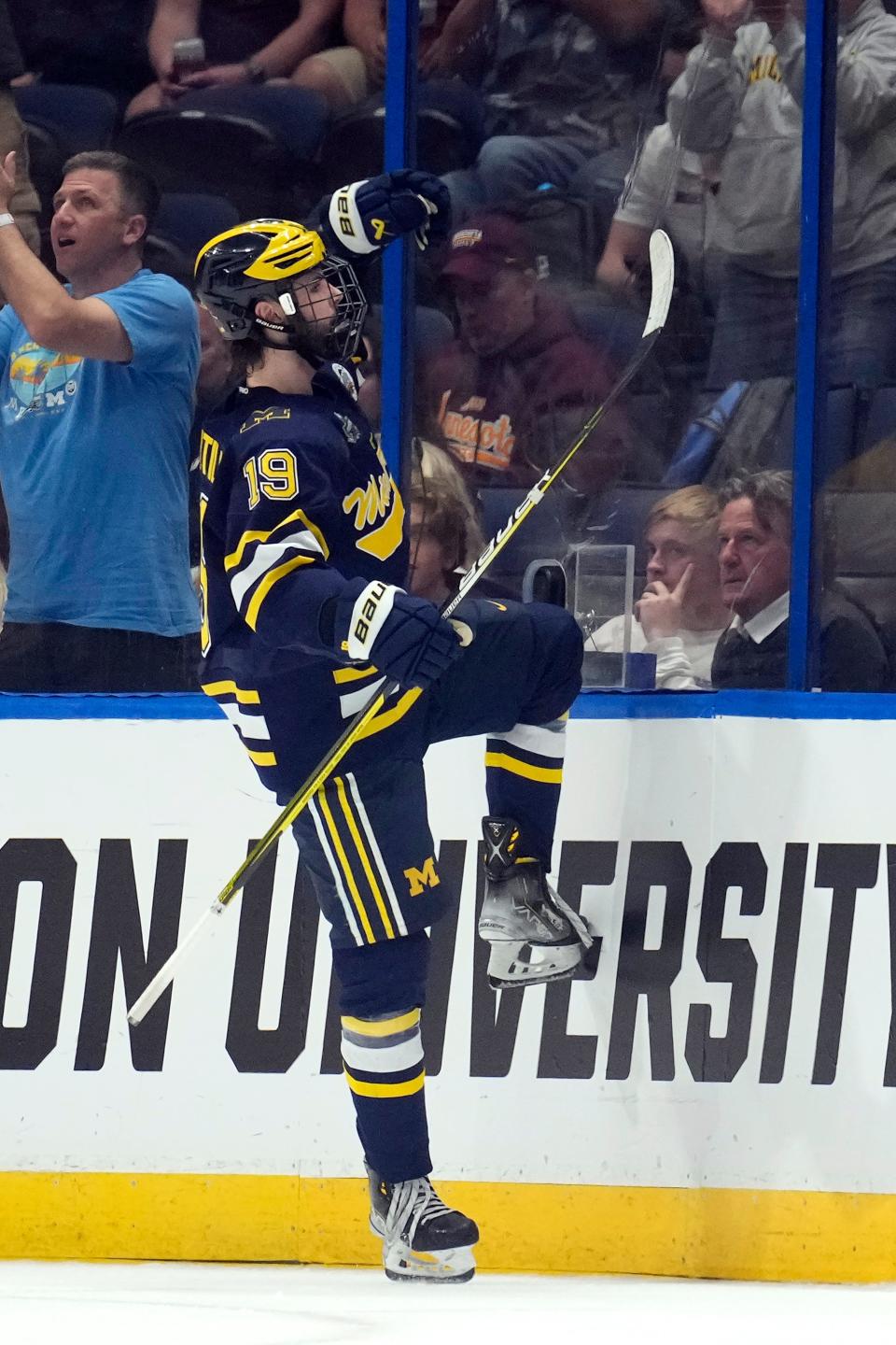 Michigan forward Adam Fantilli (19) celebrates his goal against Quinnipiac during the second period of an NCAA semifinal game in the Frozen Four at Amalie Arena in Tampa, Florida, on Thursday, April 6, 2023.