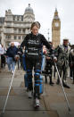 LONDON, ENGLAND - MAY 08: Claire Lomas walks the last mile of the London Marathon on May 8, 2012 in London, England. Ms Lomas, who is paralysed from the waist down after a riding accident in 2007, has taken 16 days to complete the 26.2 mile route. Starting out with 36,000 other runners she has averaged 2 miles a day with the help of a bionic ReWalk suit. (Photo by Peter Macdiarmid/Getty Images)
