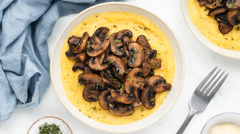 mushrooms with thyme and polenta in a bowl