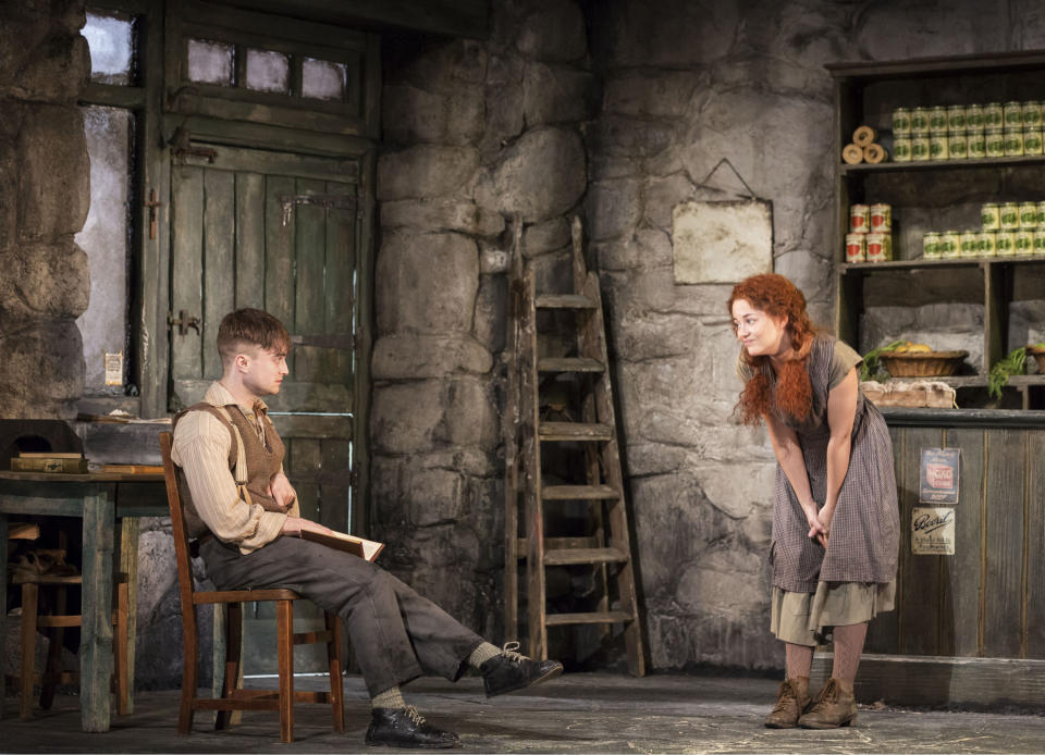 This image released by Boneau/Bryan-Brown shows Daniel Radcliffe, left, and Sarah Green performing in "The Cripple of Inishmaan," opening April 20 at the Cort Theatre in New York. (AP Photo/Boneau/Bryan-Brown, Johan Persson)