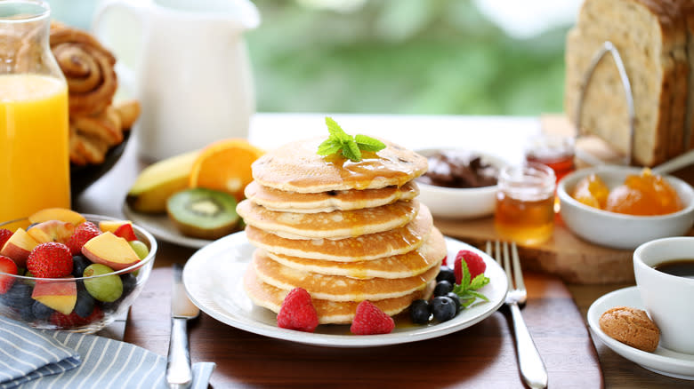 pancakes and juice on table