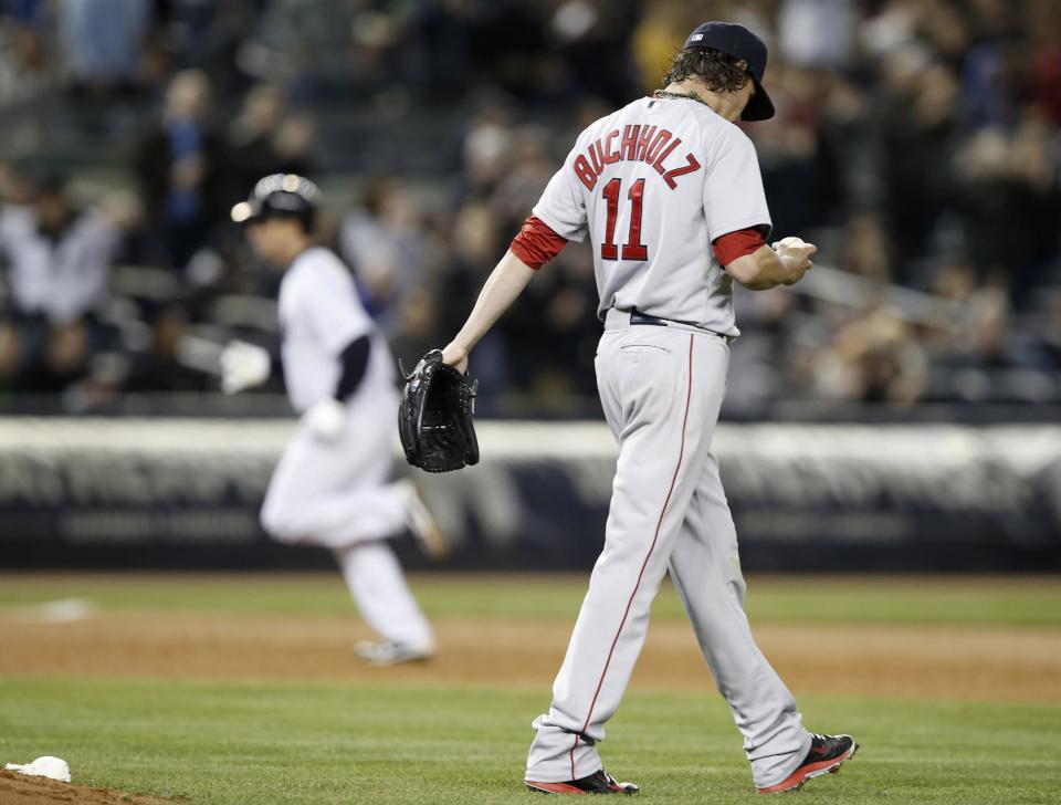 New York Yankees' Dean Anna, background left, runs the bases after hitting a fifth-inning solo home run off Boston Red Sox starting pitcher Clay Buchholz (11) in a baseball game at Yankee Stadium in New York, Thursday, April 10, 2014. (AP Photo/Kathy Willens)