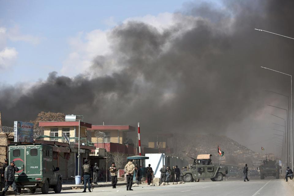 Smoke rises from a district police headquarters after a suicide bombing in Kabul, Afghanistan, Wednesday, March 1, 2017. Near-simultaneous attacks by Taliban suicide bombers have struck the Afghan capital, killing several people and wounding at least 50. (AP Photo/Rahmat Gul)
