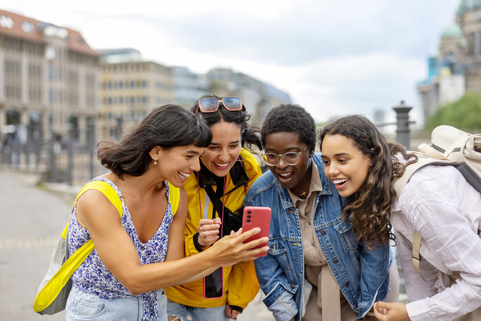 group of female friends taking a picture together on vacation