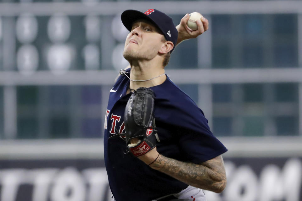 Boston Red Sox starting pitcher Tanner Houck throws against the Houston Astros during the first inning of a baseball game, Tuesday, Aug. 22, 2023, in Houston. (AP Photo/Michael Wyke)