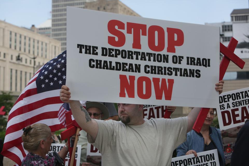 Jeremiah Suleiman, of Sterling Heights holds a sign among dozens during a rally to stop the deportation of Iraqi-American immigrants outside Patrick V. McNamara Federal building on Friday, June 16, 2017 in Detroit. An ACLU lawsuit seeks to block the possible deportation of 1,400 Iraqi nationals around the country.