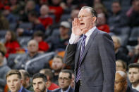 East Carolina Pirates head coach Joe Dooley directs his players from the bench during the first half of an NCAA college basketball game against Cincinnati, Sunday, Jan. 19, 2020, in Cincinnati. (AP Photo/John Minchillo)