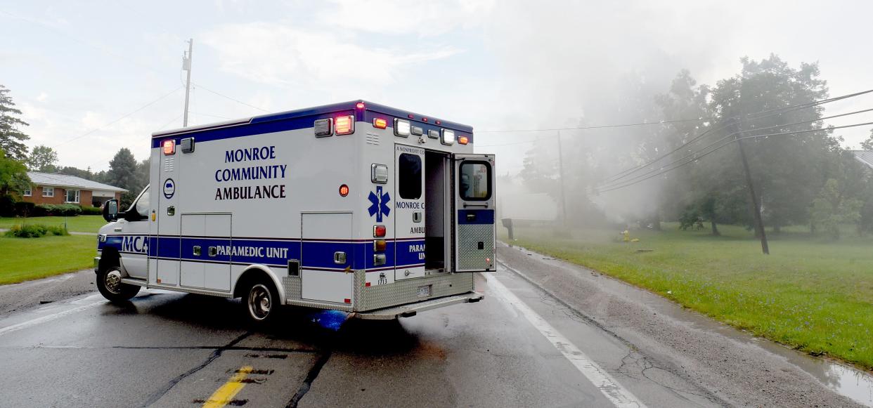 A Monroe County Ambulance unit is pictured Aug. 15, 2021, at a crash scene in Monroe. The parent company of Monroe Community Ambulance and Lenawee Community Ambulance is having a paid emergency medical technician academy starting in May.