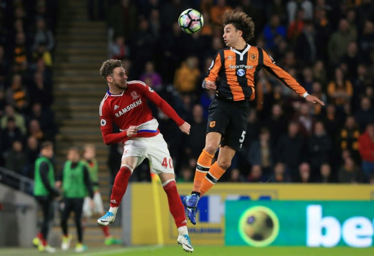 Middlesbrough's defender James Husband (L) vies with Hull City's midfielder Lazar Marković during the English Premier League football match between Hull City and Middlesbrough at the KCOM Stadium in Kingston upon Hull, on April 5, 2017