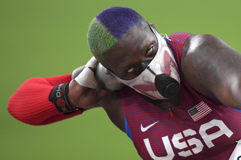 Raven Saunders, of the United States, competes in the qualification rounds of the women's shot put at the 2020 Summer Olympics, Friday, July 30, 2021, in Tokyo. (AP Photo/Matthias Schrader)