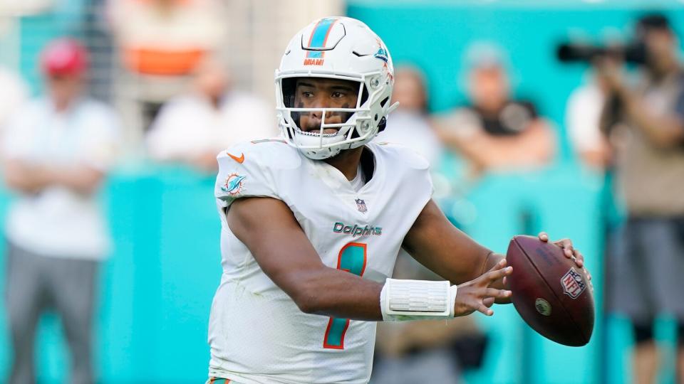 Miami Dolphins quarterback Tua Tagovailoa aims a pass.