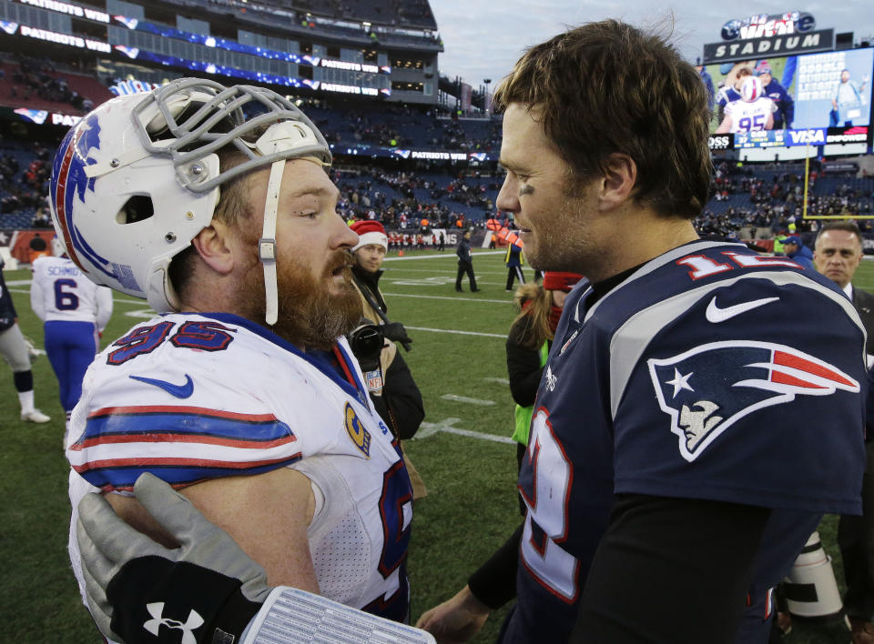 FILE - Buffalo Bills defensive tackle Kyle Williams, left, and New England Patriots quarterback Tom Brady, right, speak at midfield after an NFL football game, Sunday, Dec. 24, 2017, in Foxborough, Mass. The Patriots beat the Bills 37-16. (AP Photo/Steven Senne, File)