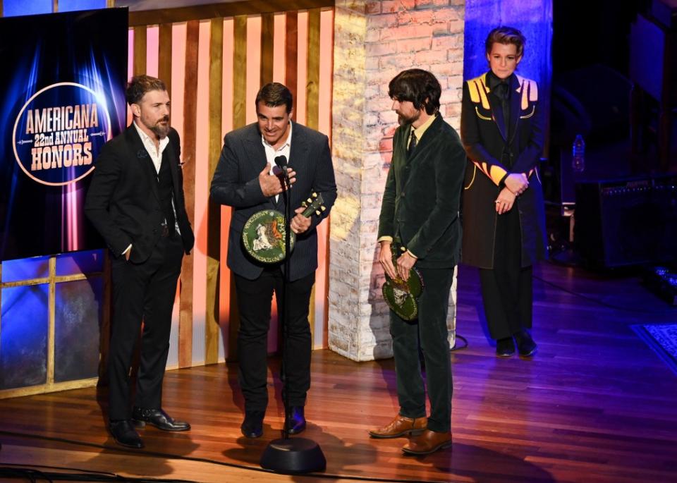 Bob Crawford, Scott Avett and Seth Avett of The Avett Brothers and Brandi Carlile at The Americana Music Association 22nd Annual Honors & Awards Show on September 20, 2023 at the Ryman Auditorium in Nashville, Tennessee.