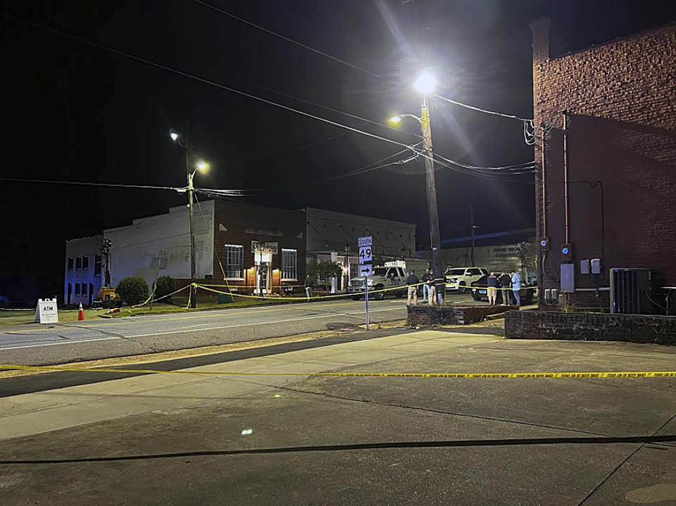 Authorities work on the scene of a shooting in Dadeville, Ala., Saturday, April 15, 2023. (Elizabeth White/WRBL via AP)