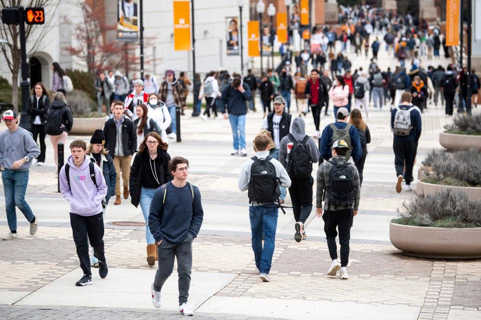 University of Tennessee students walk past the student union and the Haslam College of Business during class change on the first day of the spring semester on Monday, Jan. 24, 2022.