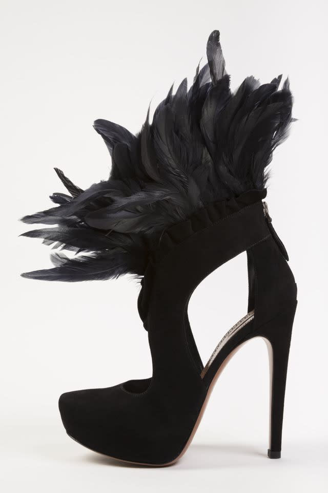 In this undated photo provided by the Fashion Institute of Technology, shows a shoe decorated with feathers and designed by Azzedine Alaia. The shoe is on display at the "Shoe Obsession" exhibit at The Museum at the Fashion Institute of Technology Museum in New York. The exhibition, showing off 153 specimens, runs through April 13. (AP Photo/Fashion Institute of Technology)