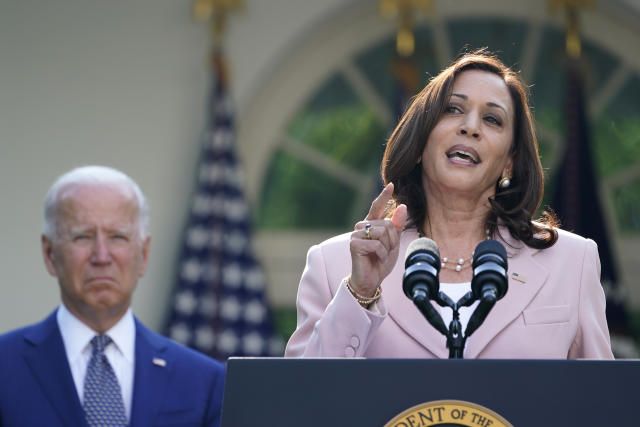 President Joe Biden listens as Vice President Kamala Harris speaks before he signs a bill in the Rose Garden of the White House, in Washington, Thursday, Aug. 5, 2021, that awards Congressional gold medals to law enforcement officers that protected members of Congress at the Capitol during the Jan. 6 riot. (AP Photo/Susan Walsh)