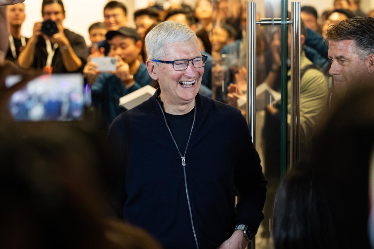 Tim Cook opens an Apple store in Shanghai in March.