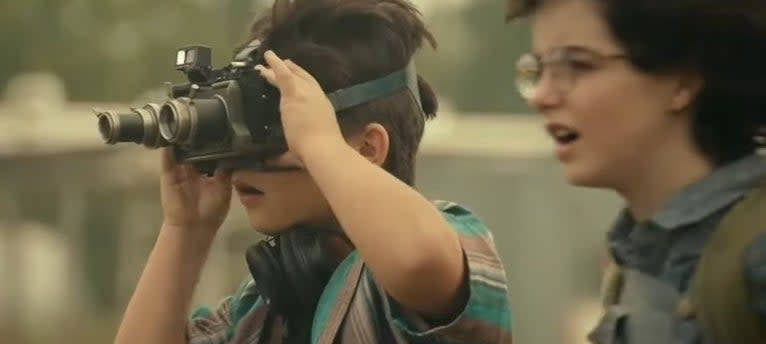 Phoebe and Podcast, who is taking a picture with his goggles, in " Ghostbusters: Afterlife"