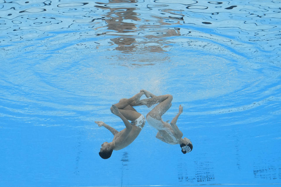 Shi Haoyu and Cheng Wentao, of China, compete in the mixed duet free final of artistic swimming at the World Aquatics Championships in Doha, Qatar, Saturday, Feb. 10, 2024. (AP Photo/Lee Jin-man)