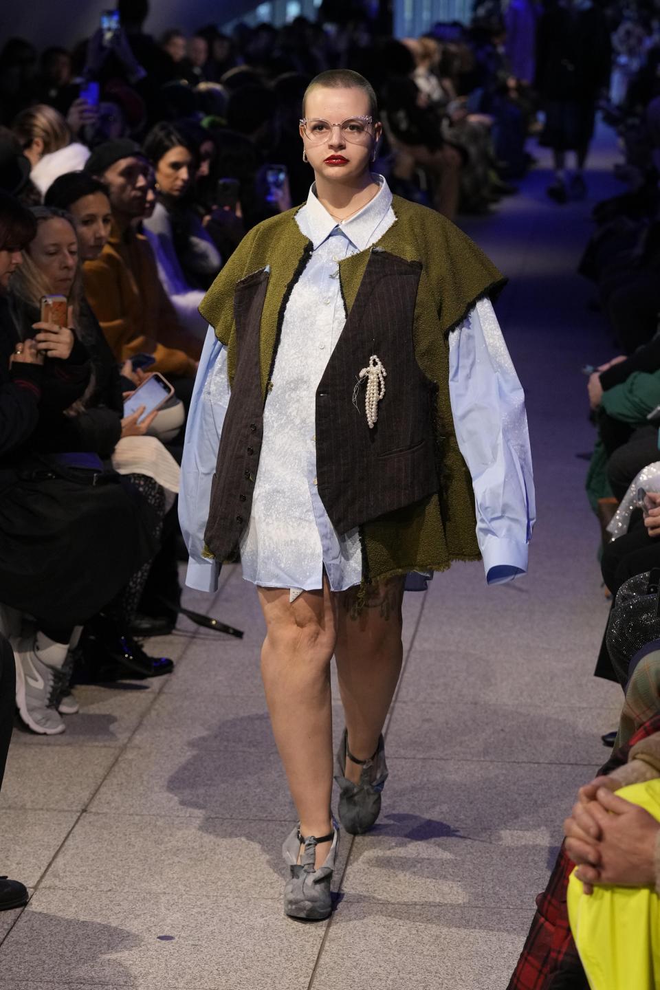 A model wears a creation part of the men's Simon Cracker Fall-Winter 2024-2025 collection, that was presented in Milan, Italy, Sunday, Jan. 14, 2024. (AP Photo/Antonio Calanni).