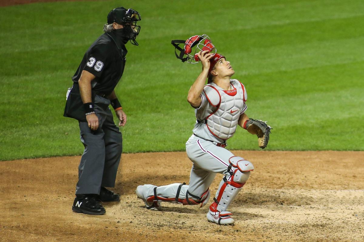 Phillies catcher J.T. Realmuto was ejected after he moved his glove while  the umpire tried to hand him the ball 👀