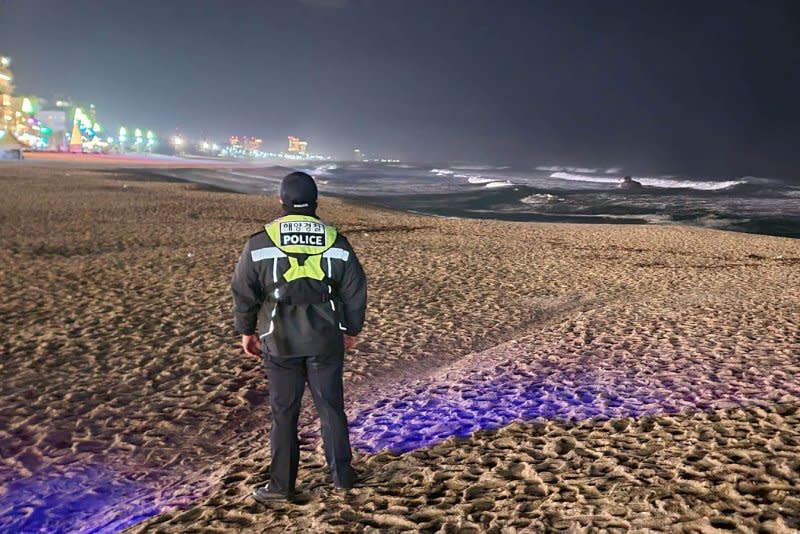 A maritime police officer patrols a beach in Gangwon Province, South Korea, as minor tsunami waves hit the waters off the east coast of the country on Monday. A 7.5 magnitude quake struck Japan's Ishikawa prefecture earlier in the day. Photo by Yonhap/EPA-EFE