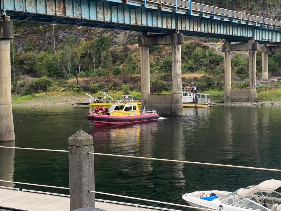 A photo posted on X on Aug. 24, 2024 showing boats responding to the incident, after the semi-truck crashed through the bridge and fell into Mara Lake.