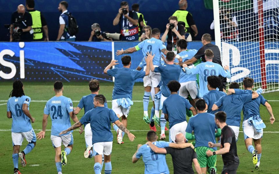 Manchester City's players celebrate winning the Super Cup