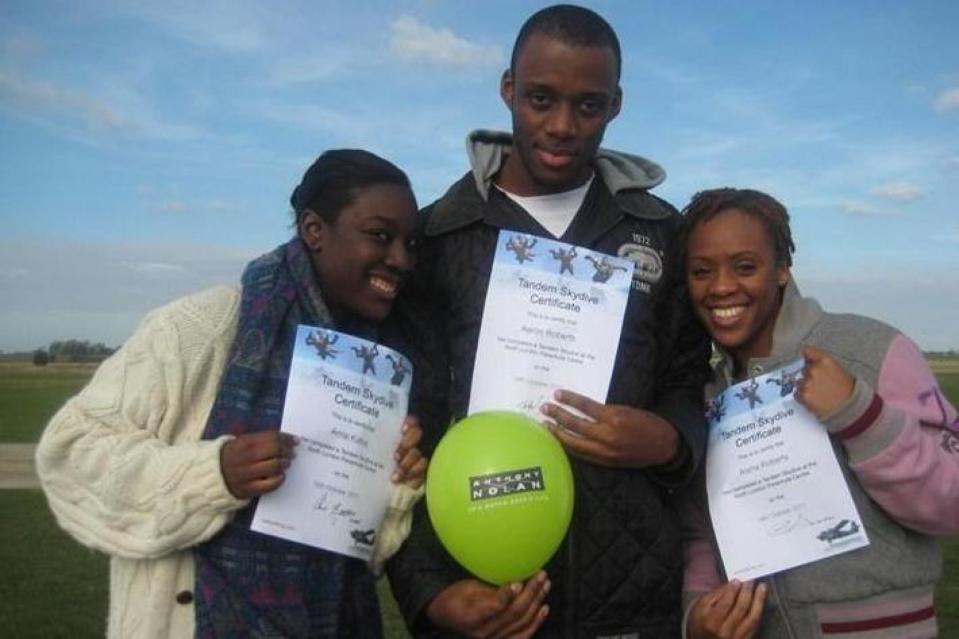 A picture posted on a fundraising site in 2011 when Ms Roberts (right) did a charity skydive (JustGiving)