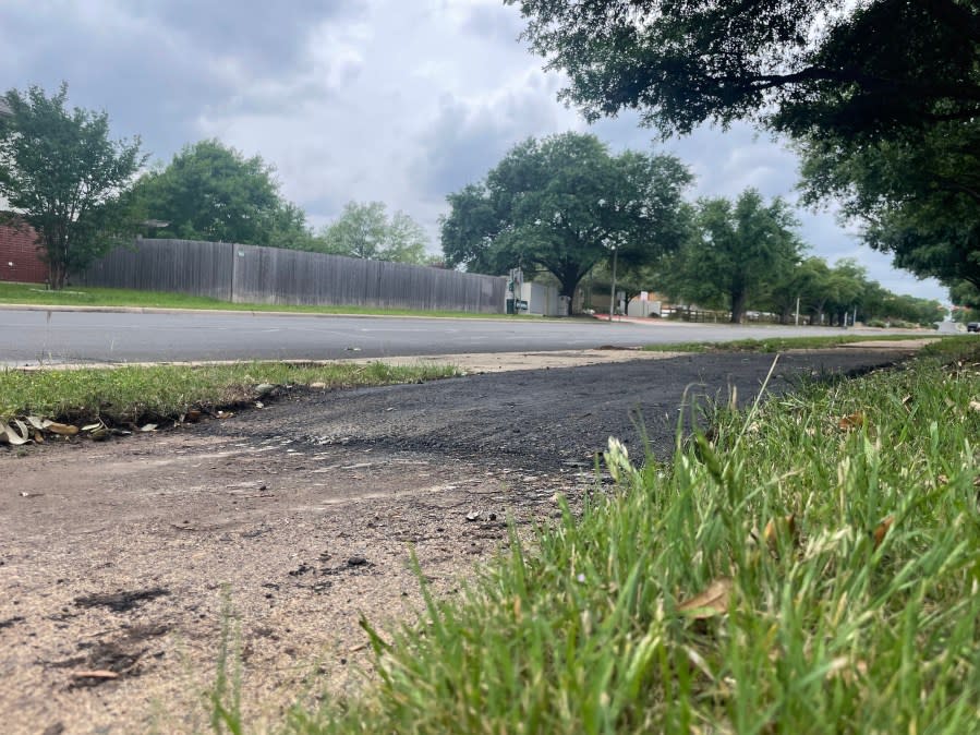 Canterbury Trails neighborhood in south Austin is an example of where the city has employed black asphalt as a temporary fix for substandard sidewalks. (KXAN Photo/Kelsey Thompson)