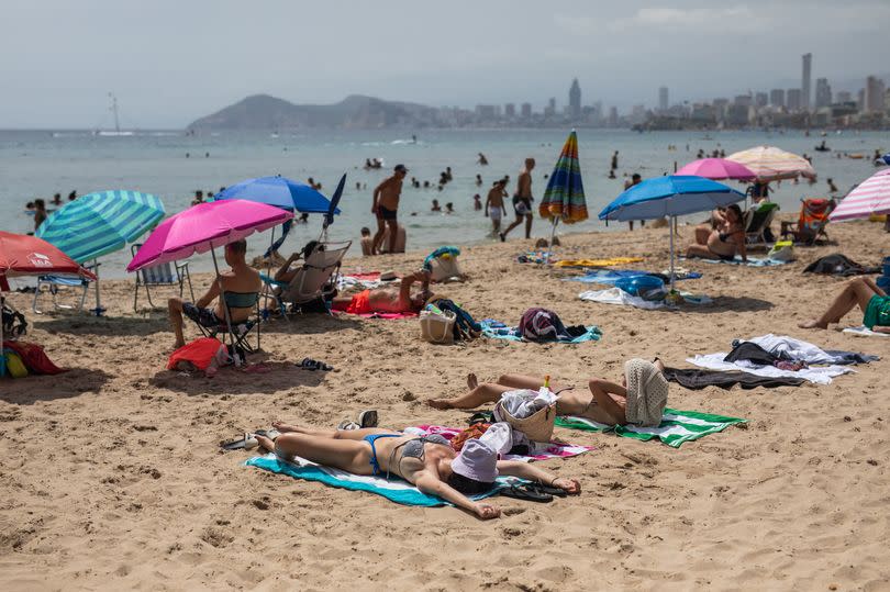 Bathers enjoying the beach in Benidorm