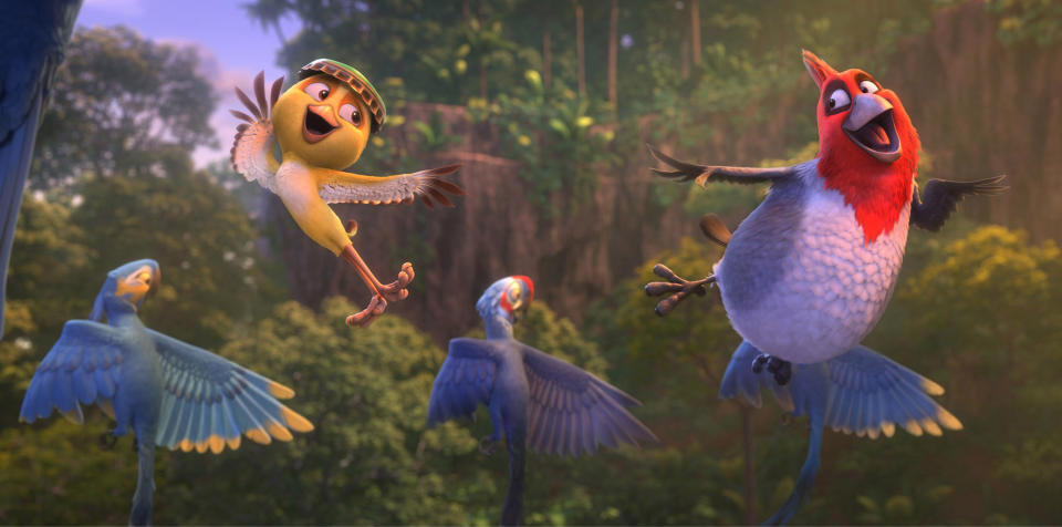 This image released by 20th Century Fox shows Nico, voiced by Jamie Foxx, foreground left, and Pedro, voiced by will.i.am in a scene from the animated film "Rio 2." (AP Photo/20th Century Fox- Blue Sky Studios)