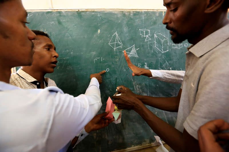 Hearing-impaired students attend a class at the College of Fine and Applied Arts in Khartoum